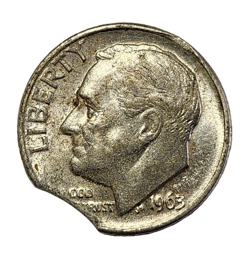 1963 dime clipped planchet error showing curved section missing from coin edge
